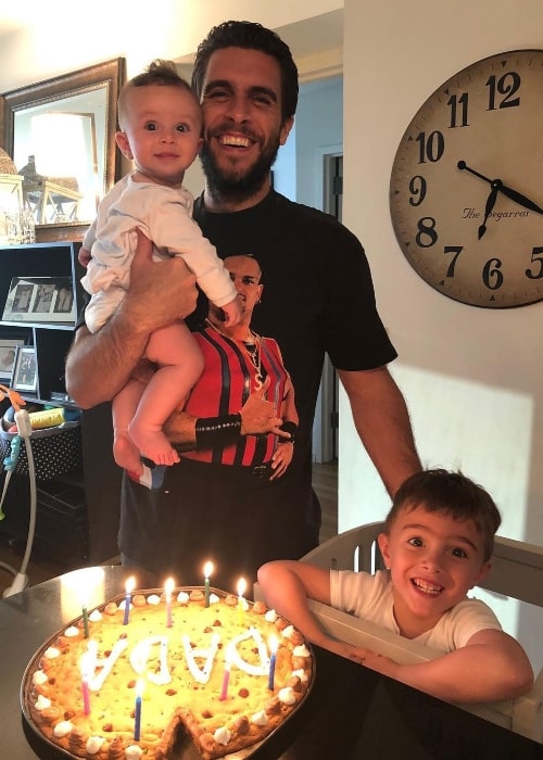 Josh Segarra smiling for a picture alongside his sons in June 2020