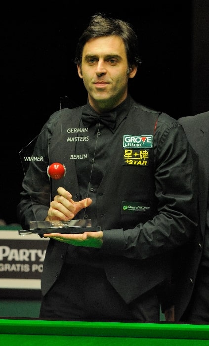 Ronnie O'Sullivan as seen while posing for the camera with the 2012 German Masters trophy
